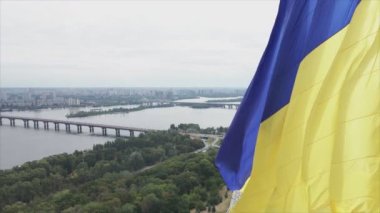 This stock footage shows aerial view of the national flag of Ukraine in Kyiv in 8K resolution