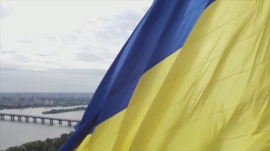 This stock footage shows aerial view of the national flag of Ukraine in Kyiv in 8K resolution
