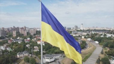 This stock footage shows aerial view of the national flag of Ukraine in Kyiv in 8K resolution