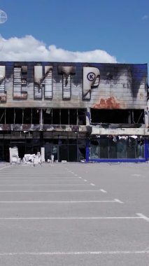 This stock vertical video shows a destroyed building of a shopping center in Bucha