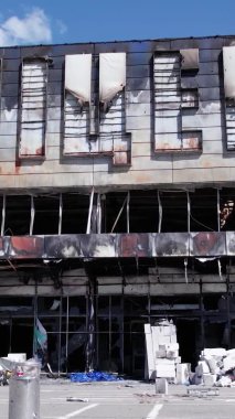 This stock vertical video shows a destroyed building of a shopping center in Bucha