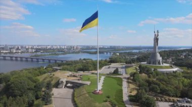 This stock footage shows aerial view of the national flag of Ukraine in Kyiv in 8K resolution