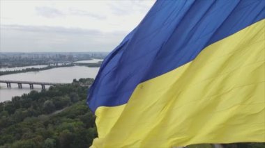 This stock footage shows aerial view of the national flag of Ukraine in Kyiv in 8K resolution