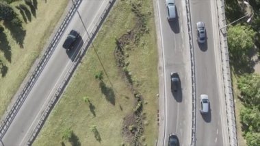 This stock footage shows an aerial view of a traffic intersection with cars driving along it in Kyiv, Ukraine in 8K resolution