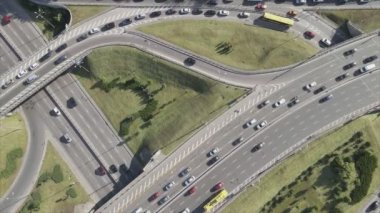 This stock footage shows an aerial view of a traffic intersection with cars driving along it in Kyiv, Ukraine in 8K resolution
