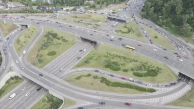 This stock footage shows an aerial view of a traffic intersection with cars driving along it in Kyiv, Ukraine in 8K resolution
