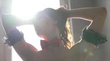 This stock video shows a beautiful woman in sexy lingerie moving seductively, slow motion