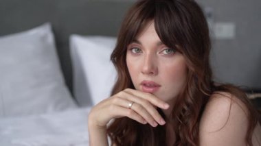 This stock video shows a beautiful woman in sexy lingerie moving seductively, slow motion