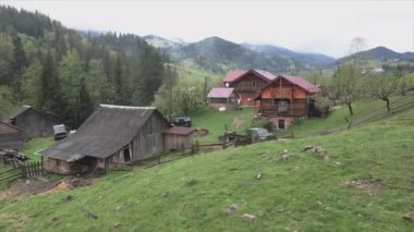 This stock video shows an aerial view of a house in the Carpathian mountains, Ukraine in 8K resolution