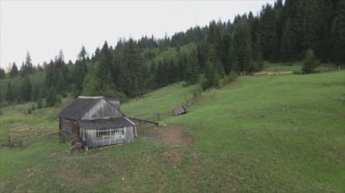 This stock video shows an aerial view of a house in the Carpathian mountains, Ukraine in 8K resolution
