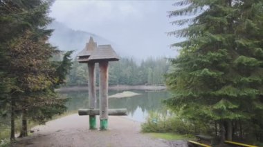 This stock video shows an aerial view of Synevyr Lake in the Carpathian Mountains, Ukraine in 8K resolution