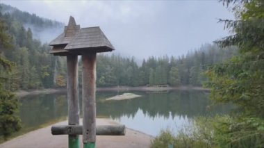 This stock video shows an aerial view of Synevyr Lake in the Carpathian Mountains, Ukraine in 8K resolution