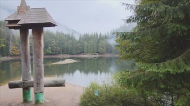 This stock video shows an aerial view of Synevyr Lake in the Carpathian Mountains, Ukraine in 8K resolution