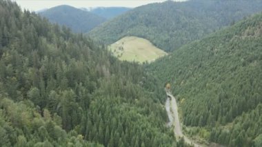 This stock footage shows aerial view of the mountain landscape of the Carpathians, Ukraine in 8K resolution