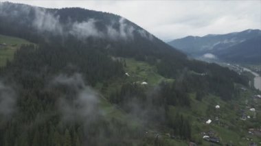 This stock footage shows aerial view of the mountain landscape of the Carpathians, Ukraine in 8K resolution