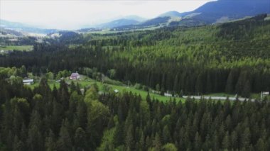 This stock footage shows aerial view of the mountain landscape of the Carpathians, Ukraine in 8K resolution
