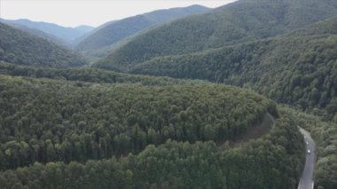 This stock footage shows aerial view of the mountain landscape of the Carpathians, Ukraine in 8K resolution