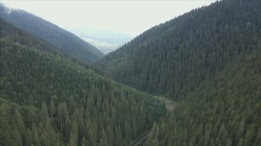 This stock footage shows aerial view of the mountain landscape of the Carpathians, Ukraine in 8K resolution