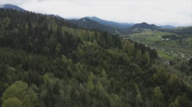 This stock footage shows aerial view of the mountain landscape of the Carpathians, Ukraine in 8K resolution