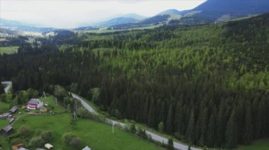 This stock footage shows aerial view of the mountain landscape of the Carpathians, Ukraine in 8K resolution