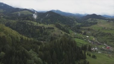 This stock footage shows aerial view of the mountain landscape of the Carpathians, Ukraine in 8K resolution