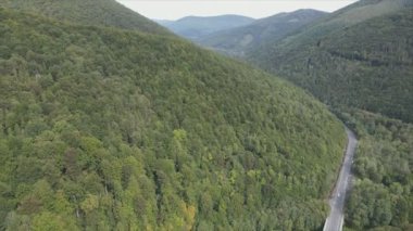 This stock footage shows aerial view of the mountain landscape of the Carpathians, Ukraine in 8K resolution