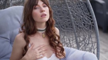 This stock video shows a beautiful woman in sexy lingerie moving seductively, slow motion