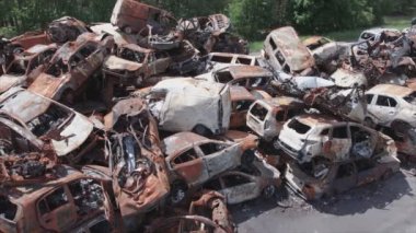 This stock video shows a dump of shot and burned cars in Irpin, Bucha district in 8K resolution