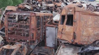 This stock video shows a dump of shot and burned cars in Irpin, Bucha district in 8K resolution