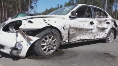 This stock video shows a dump of shot and burned cars in Irpin, Bucha district in 8K resolution