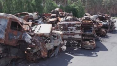 This stock video shows a dump of shot and burned cars in Irpin, Bucha district in 8K resolution