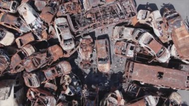 This stock video shows a dump of shot and burned cars in Irpin, Bucha district in 8K resolution