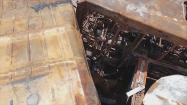 This stock video shows a dump of shot and burned cars in Irpin, Bucha district in 8K resolution