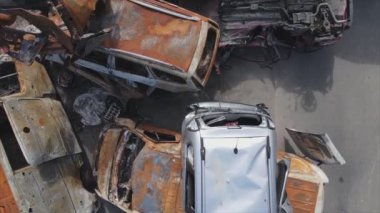 This stock video shows a dump of shot and burned cars in Irpin, Bucha district in 8K resolution