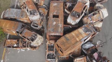This stock video shows a dump of shot and burned cars in Irpin, Bucha district in 8K resolution