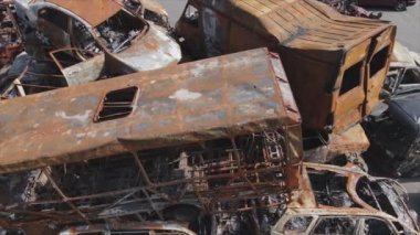This stock video shows a dump of shot and burned cars in Irpin, Bucha district in 8K resolution