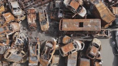 This stock video shows a dump of shot and burned cars in Irpin, Bucha district in 8K resolution