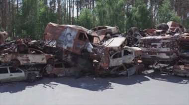 This stock video shows a dump of shot and burned cars in Irpin, Bucha district in 8K resolution