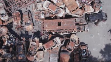 This stock video shows a dump of shot and burned cars in Irpin, Bucha district in 8K resolution