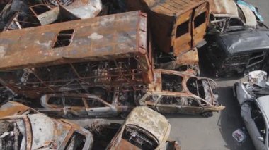 This stock video shows a dump of shot and burned cars in Irpin, Bucha district in 8K resolution