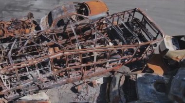 This stock video shows a dump of shot and burned cars in Irpin, Bucha district in 8K resolution