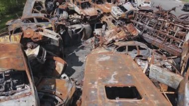 This stock video shows a dump of shot and burned cars in Irpin, Bucha district in 8K resolution