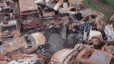 This stock video shows a dump of shot and burned cars in Irpin, Bucha district in 8K resolution