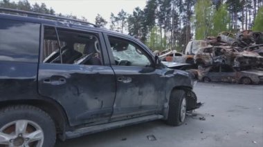 This stock video shows a dump of shot and burned cars in Irpin, Bucha district in 8K resolution