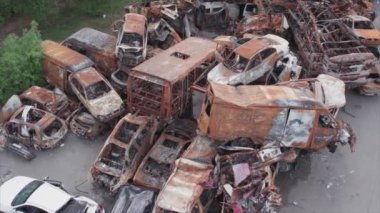 This stock video shows a dump of shot and burned cars in Irpin, Bucha district in 8K resolution
