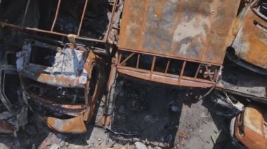 This stock video shows a dump of shot and burned cars in Irpin, Bucha district in 8K resolution