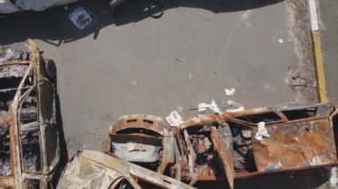 This stock video shows a dump of shot and burned cars in Irpin, Bucha district in 8K resolution