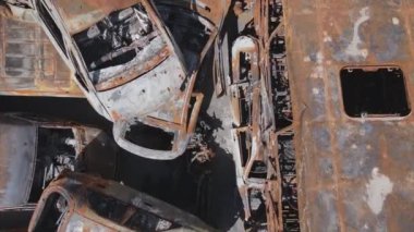 This stock video shows a dump of shot and burned cars in Irpin, Bucha district in 8K resolution