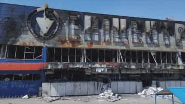 This stock video shows a destroyed building of a shopping center in Bucha, Ukraine during the war in 8K resolution