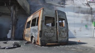 This stock video shows a destroyed building of a shopping center in Bucha, Ukraine during the war in 8K resolution